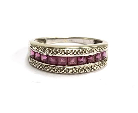 A 9ct white gold, calibre cut ruby and diamond ring, size P, 2.7g