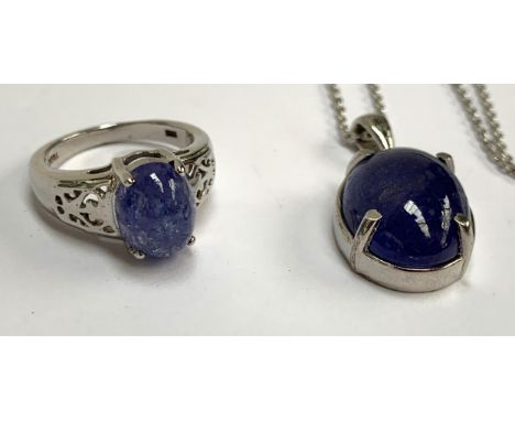 A sterling silver ring set with a tanzanite cabochon, 3.6cts, size K, 3.3g; together a similar silver pendant, 7.3g