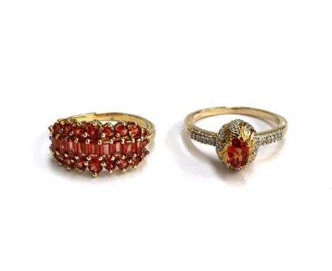 A 9ct gold ring set with a red/orange Songea sapphire and white zircons, size P 1/2, 3.3g; together with a 925 silver ring se