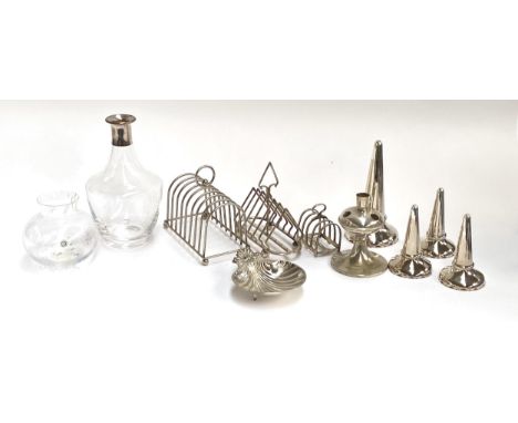 A Dartington glass decanter with silver plated collar; Dartington 'confetti' vase; silver plated toast racks; silver plated c