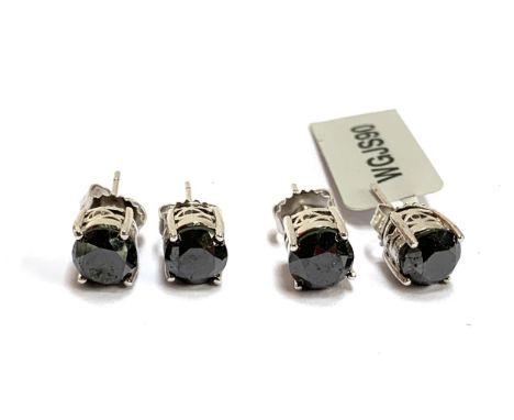 Two pairs of silver and black diamond stud earrings, each diamond approx. 1.5cts, gross weight 4.2g