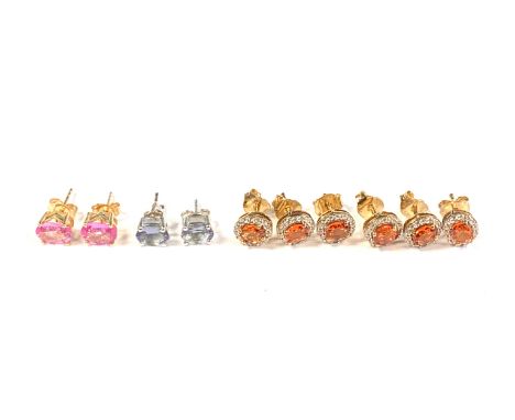 A pair of 9ct gold pink spinel stud earrings, 1.4g; together with a pair of silver mounted tanzanite earrings; silver songea 