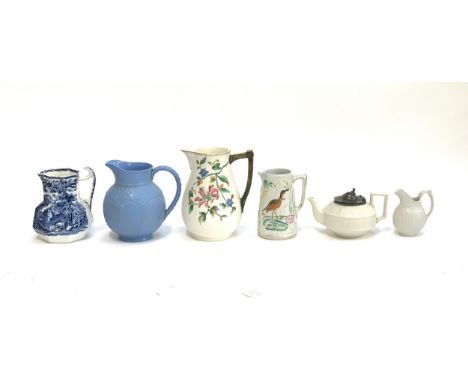 A collection of mainly Victorian jugs to include a Cobridge blue moulded jug, rd. mark to base; James Dudson moulded jug with