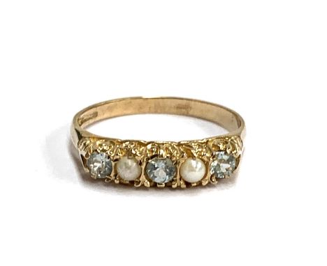 A 9ct gold ring set with blue topaz and pearls, size Q, 2g