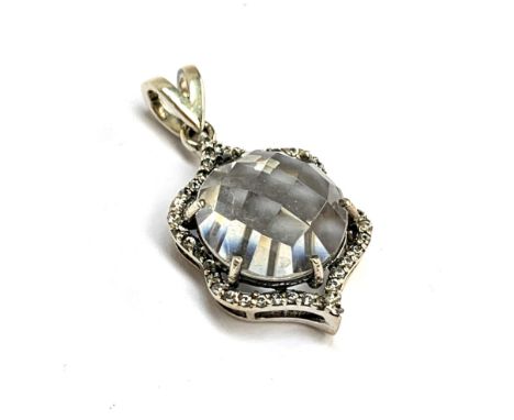 A silver pendant set with a Golconda quartz and natural white zircons, the checkerboard cut Indian quartz 4.6cts, 2.8g