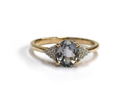 A 9ct gold ring set with a bicolour tanzanite and natural white zircons, size S, 2.4g