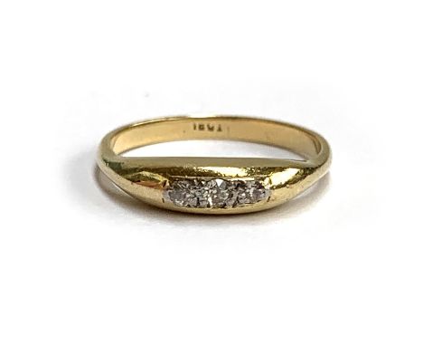 An early 20th century 18ct gold ring set with three old cut diamonds, size M, 2.9g