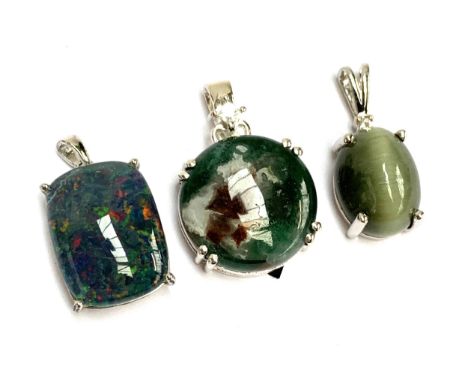 Three silver pendants, an Aquaprase cabochon and white zircon, 2cmD; Cats eye; and opal triplet, 16g gross weight