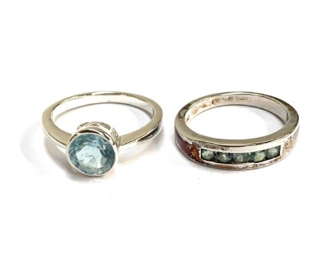 A silver ring channel set with Orissa alexandrite, size R 1/2; together with a silver and aquamarine solitaire ring, size S; 