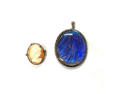 An Art Deco silver mounted morpho butterfly wing pendant, 4cmL; together with a small shell cameo brooch