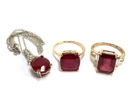 Two 9ct gold ruby cocktail rings, 9.6g gross weight; together with a ruby pendant