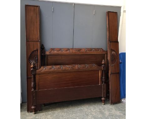 A mahogany double bed, carved head and footboard flanked by reeded columns, the headboard approx. 128cmH