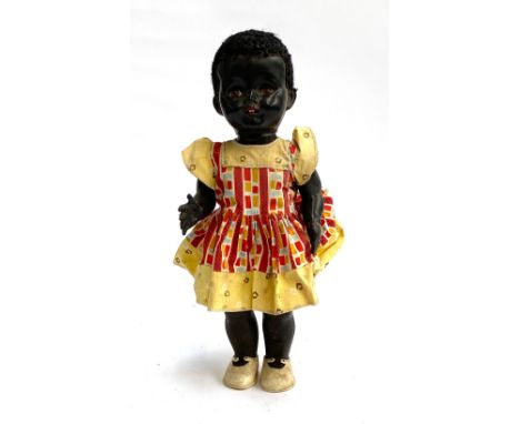 A vintage 1950s Pedigree walking black doll