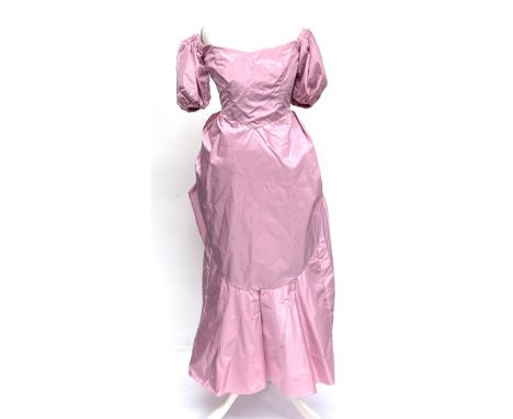 A vintage pink satin gown with puffed sleeves and oversized bow, with boning, approx. size 10Provenance: from the wardrobe of