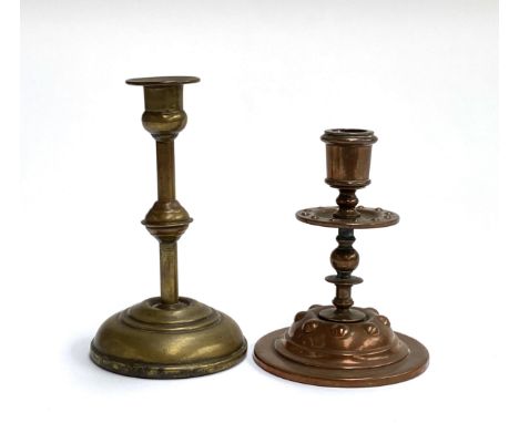 A Newlyn style arts and crafts copper candlestick, 12cmH; together with a further small brass candlestick, 15cmH