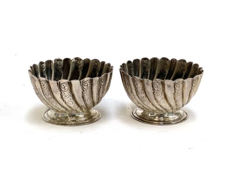 A pair of late Victorian silver salts by Josiah Williams &amp; Co, London 1894, spirally gadrooned on small spreading feet, 1