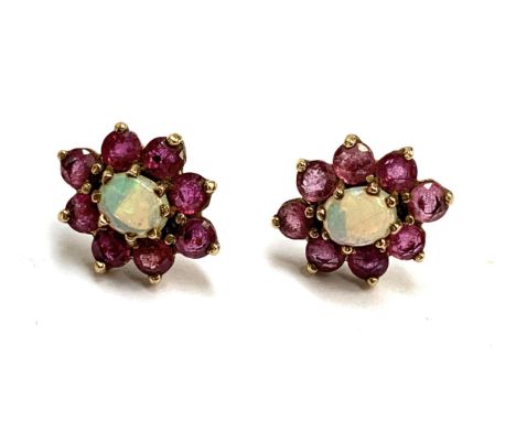 A pair of 9ct gold, ruby and opal stud earrings, 1.3cmL, 2g