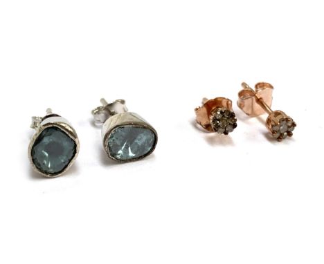 A pair of silver and blue polki diamond stud earrings; together with a pair of rose vermeil silver stud earrings set with dia