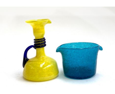 A 1930s Loetz 'Tango' yellow glass jug with blue spiral decoration, 16.5cmH; together with a hand blown blue glass rinser (2)