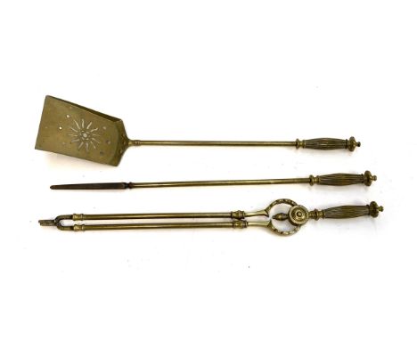 An Arts and Crafts set of brass fire tools, comprising shovel, tongs and poker