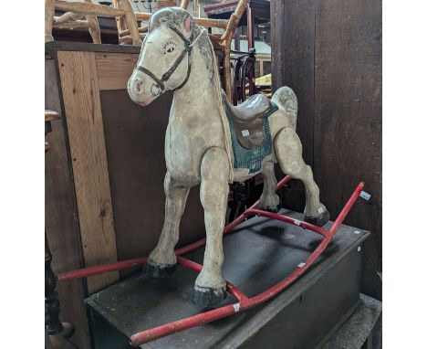 A painted metal rocking horse, 110cmL