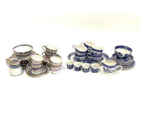 A quantity of Willow blue and white ceramics to include Woods Ware and Johnson Bros.; together with Noritake blue lustre part