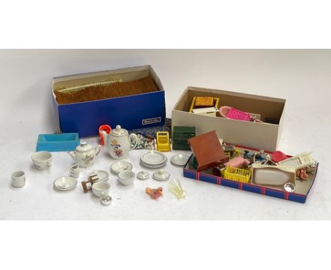 A quantity of vintage dolls house furniture and dolls tea set