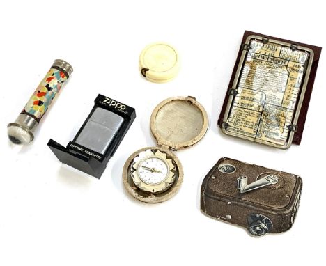 A small lot to include vintage Zippo lighter; vintage torch; Peter 2 Rubis travel clock etc