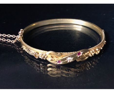 Antique Jewellery; A 15ct Gold Victorian Bracelet set with Diamond recessed in a star setting and flanked by two similar set 