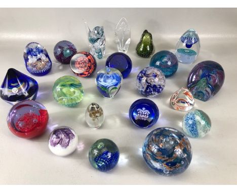 Paperweights, a collection of vintage glass paper weights of varying patterns and shapes the majority being Caithness 21 in t