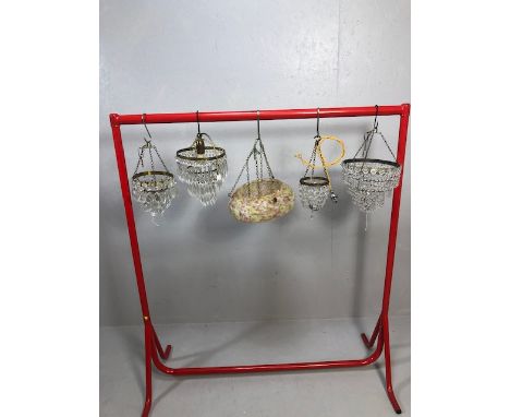 Vintage lighting, four small decorative chandeliers of varying sizes and styles along with a mid century glass pendant shade 