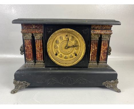 American eight day Sessions Clock Co mantel clock. Late 19th Century, in an ebonised wood case with copper finish masks, and 