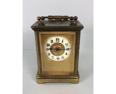 Antique Carriage clock, late 19th Century with once gilded brass case set with glass panels, enamel chapter ring with black n