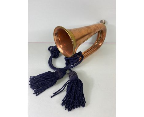 Musical instruments, vintage military brass bugle with blue tassel cords marked Dallas London.