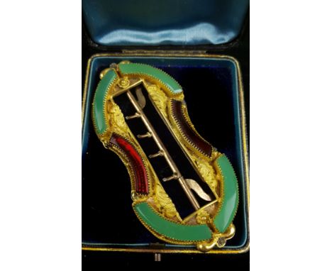 A French yellow metal ornate belt buckle, set with paste 'jade' and garnet coloured curved panels, within leaf motifs, 10.5cm