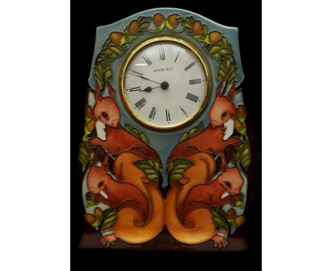 Vicky Lovett for Moorcroft Pottery. A Red Squirrel pattern clock of CL3 Shape, removable quartz movement marked Moorcroft to 