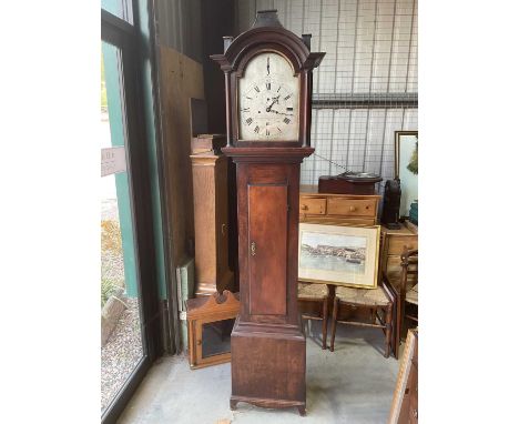 An early 19th century mahogany longcase clock with arched pediment above silvered dial inscribed 'Thomas Reynolds, Oxon', wit