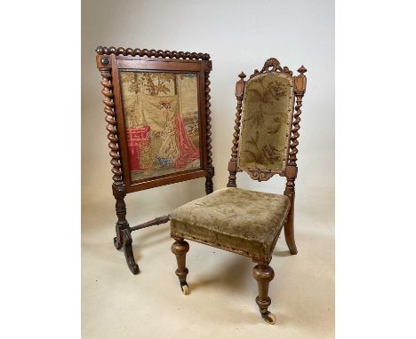 A Victorian nursing chair with barleytwist uprights, padded back and seat, and a Victorian fire screen with needlework panel 