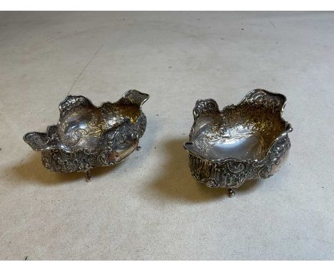 GEORGE EDWARD &amp; SONS; a pair of Scottish late Victorian quatrelobed bowls with allover floral embossed detail and raised 