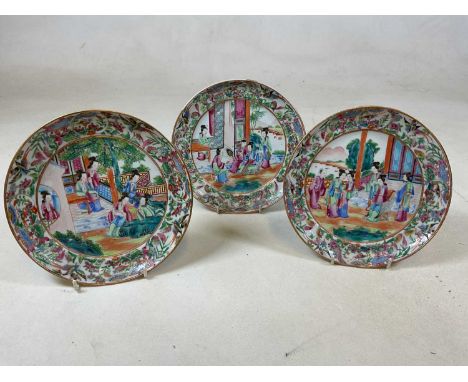 A set of three mid 19th century Chinese Canton Famille Rose enamel painted plates, diameter 19.5cm (3)Condition Report: Minor