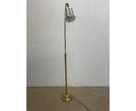 An adjustable brass floor lamp and milk glass shade with painted floral panels, height 153cm.