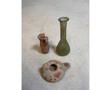 A Roman green tinted glass teardrop vase, height 11.5cm, an early Turkish lamp, length 7.75cm, and an early Turkish small ves