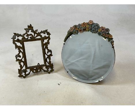 An early 20th century barbola mirror with easel back and encrusted floral detail, diameter 28cm diameter, also a baroque bras