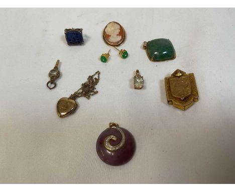 A small group of jewellery including a 9ct yellow gold framed and jade coloured polished stone pendant, a locket, small cameo