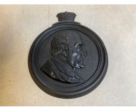A mid 19th century cast iron plaque set with the profile portrait of the Duke of Wellington, the reverse inscribed 'Moulded b