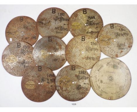 Nine small polyphon discs, 18cm diameter and a steel barometer dial 
