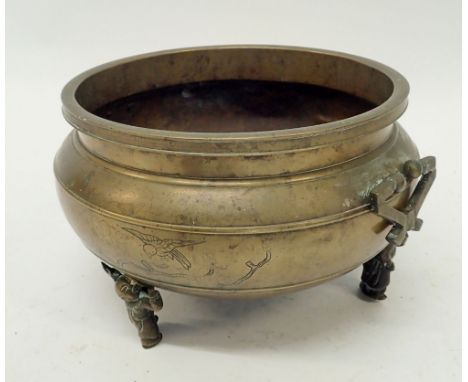 A 19th century Chinese bronze jardiniere with engraved bird decoration all on triple figure supports, 27cm diameter 