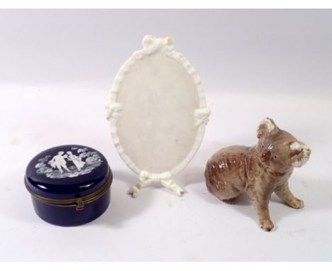 A blue porcelain trinket box with enamel decoration, an oval menu stand with Victorian registration mark and Beswick Koala be