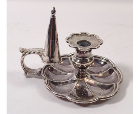 An early 19th century small silver chamber stick with fluted base, London 1836 and matched snuffer, 161g, 10cm diameter 