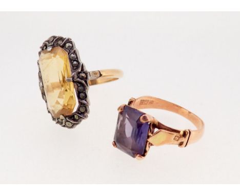 A gold ring set amethyst with Egyptian marks for 18ct, 1.8g, size M and a citrine and marcasite ring with replaced unmarked b